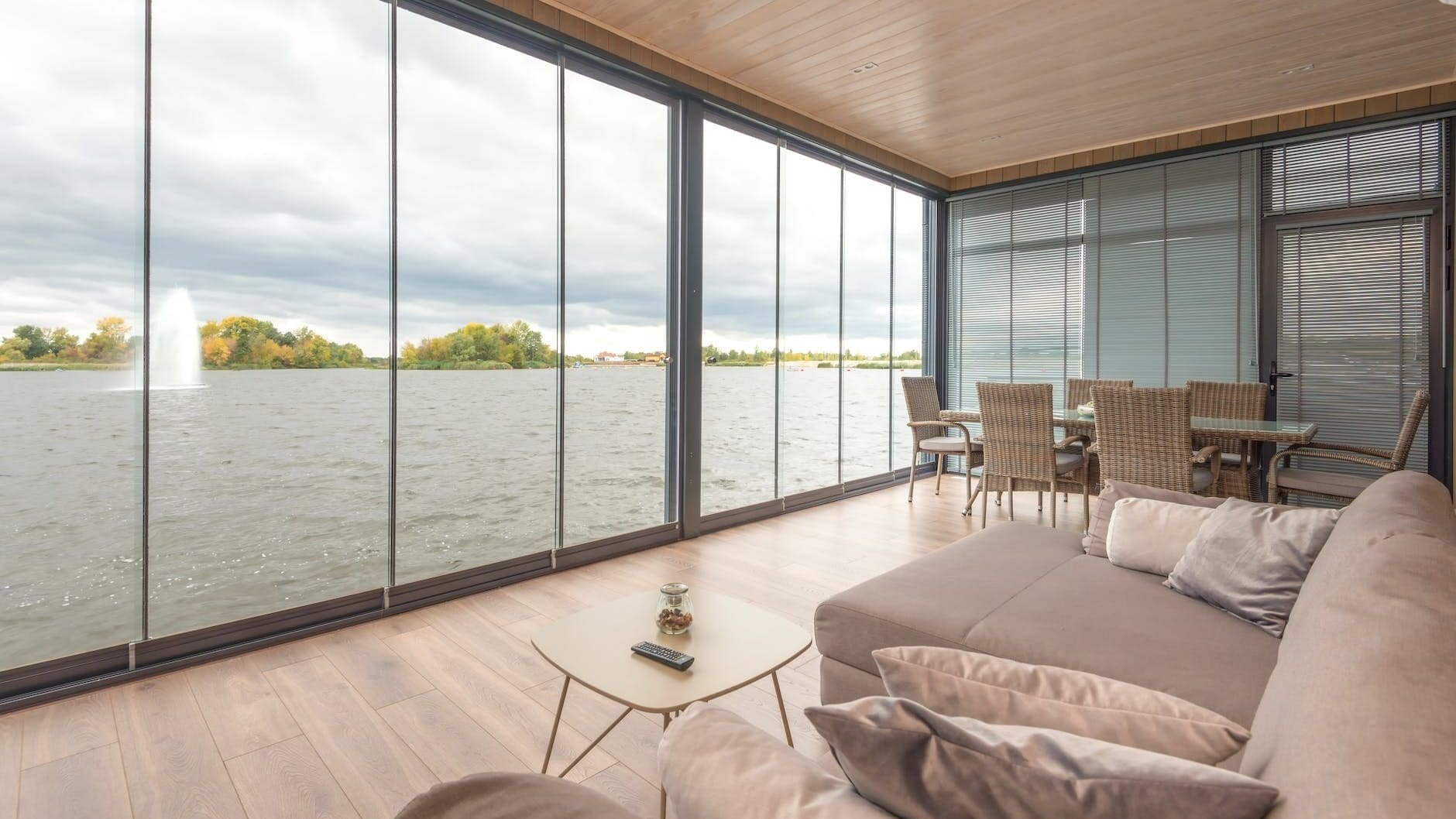 interior of contemporary house on lake on cloudy day, good for choosing the right automated blinds for million-dollar homes