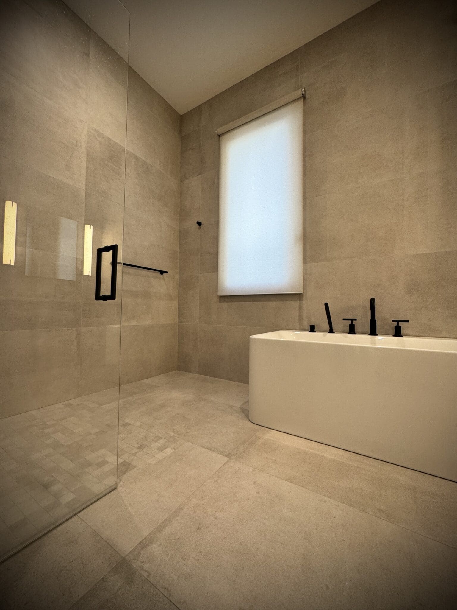 Primary bath with a motorized Lutron shade in a Cambridge, MA home