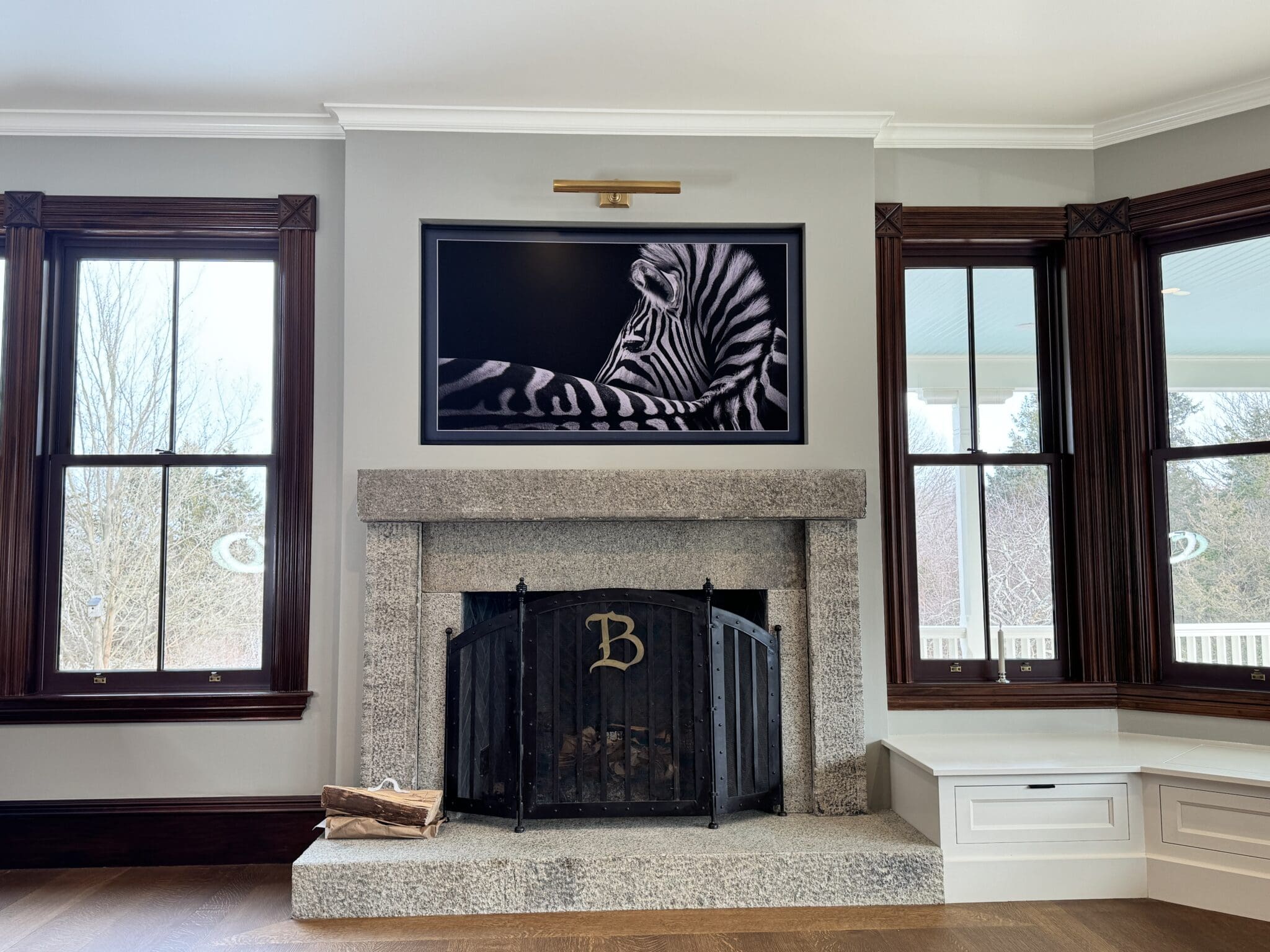 Samsung Frame TV over a stone fireplace in a restored Queen Anne in Plymouth, MA