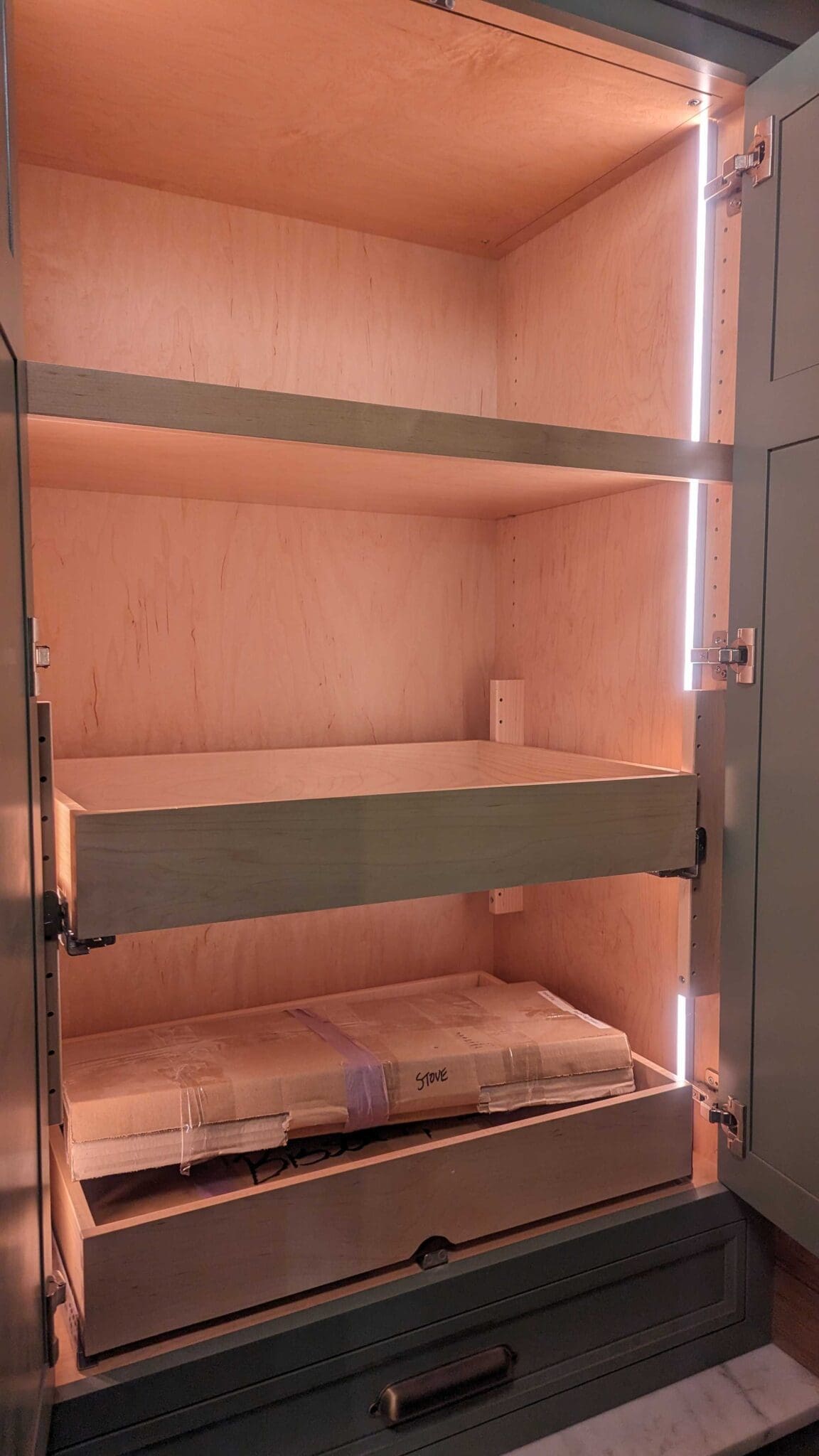 Closet with hidden LED tape lighting that turns on with the door