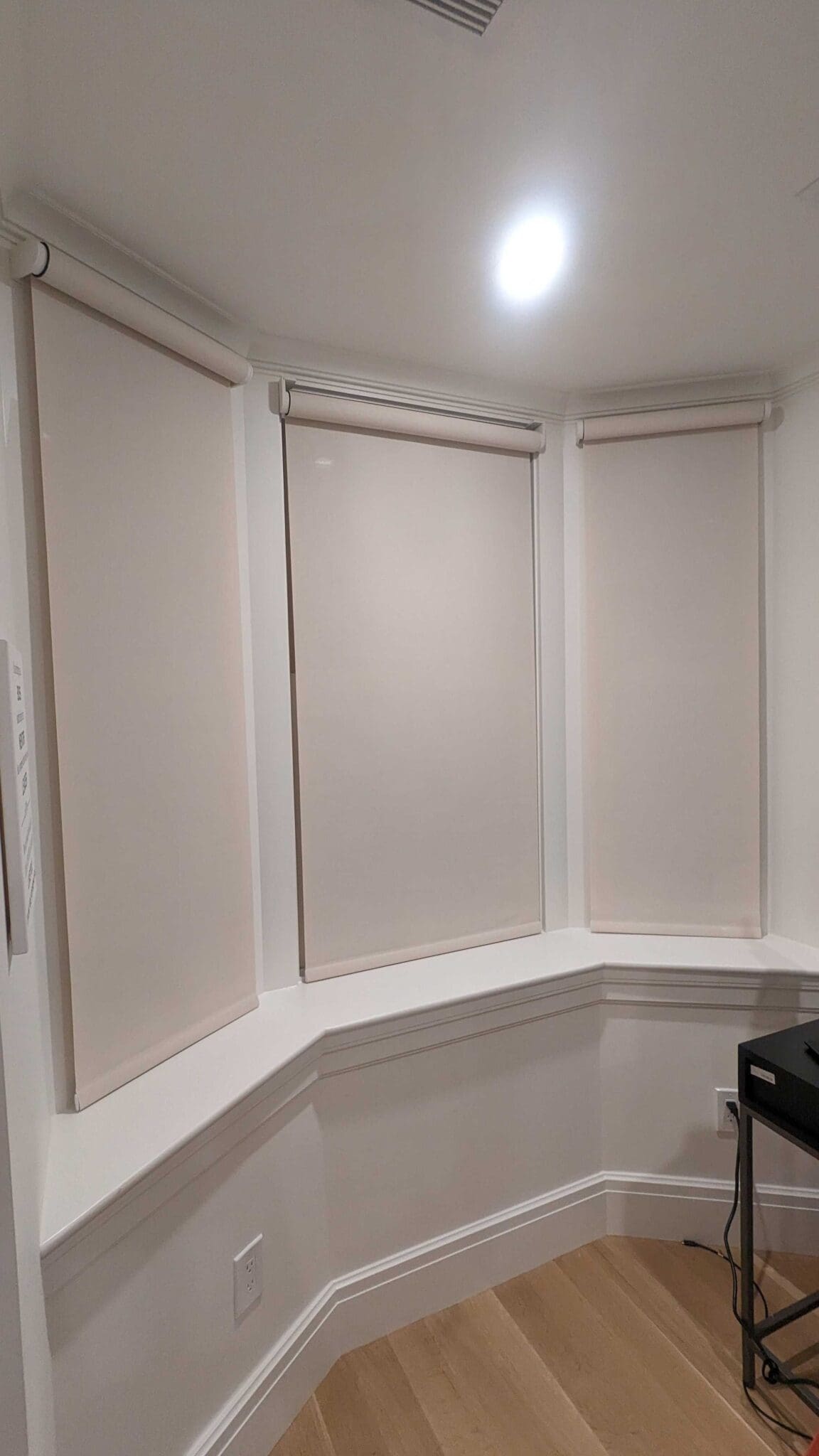 Lutron Palladiom shades in a curved bay window in the South End, Boston