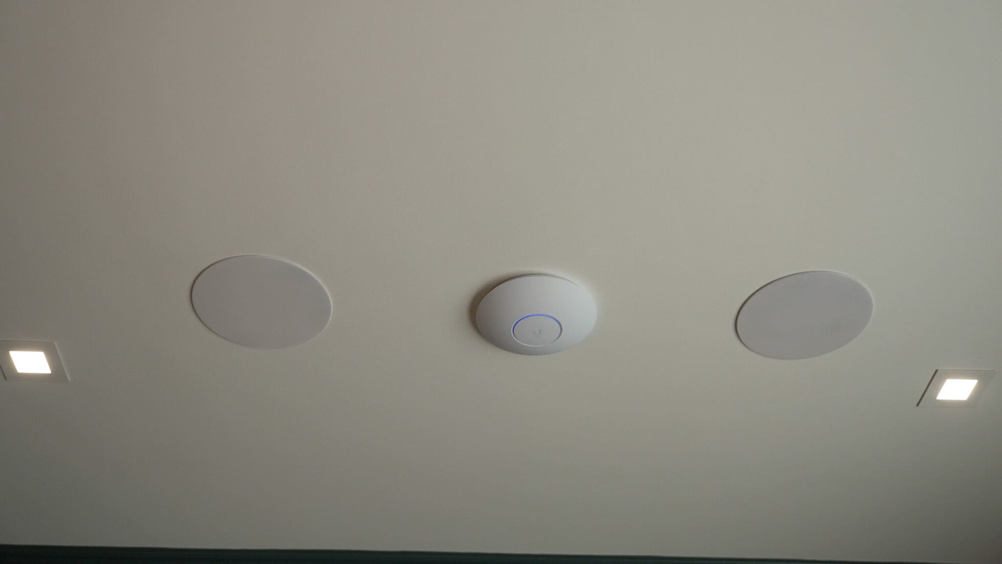 Ceiling speakers and a Wi-Fi access point in a Boston home