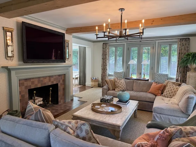 Family room with a TV above the fireplace and a soundbar built into the mantel