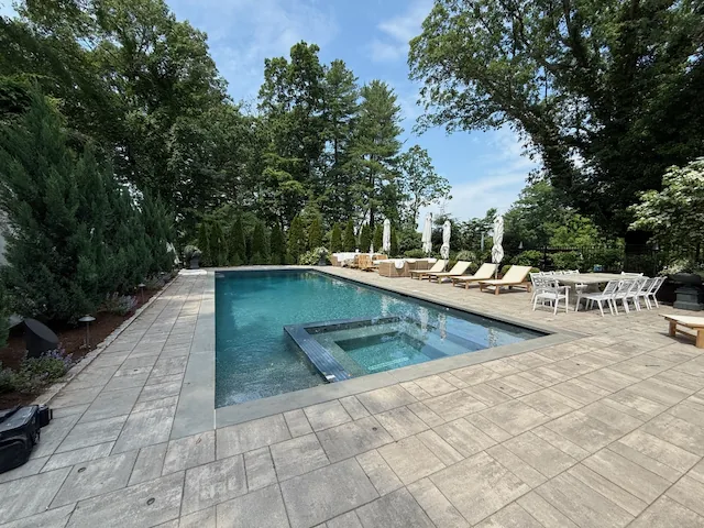 Pool and patio with Coastal Source landscape speakers in Needham, MA