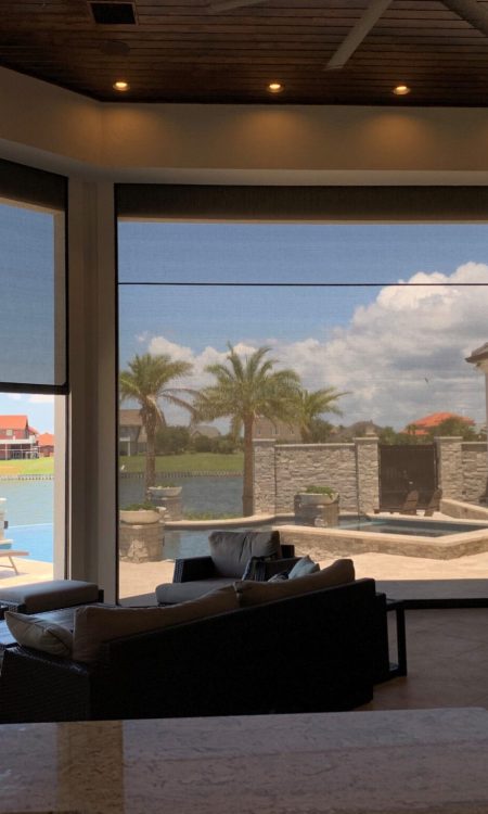 outdoor poolside patio equipped with outdoor screen system